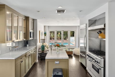 Fully equipped kitchen with breakfast bar and high-end appliances