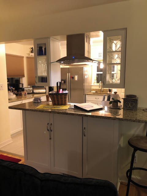 There is an open bar from the living room to the kitchen.