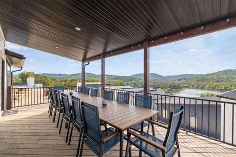 Take in stunning lake views from the expansive covered deck- the perfect spot for crisp mornings or sunset dinners