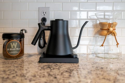 Coffee station with our Go Wander blend, a kettle, and a Chemex for the perfect brew.
