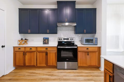 Clean and organized kitchen space with plenty of cabinet storage and modern appliances.