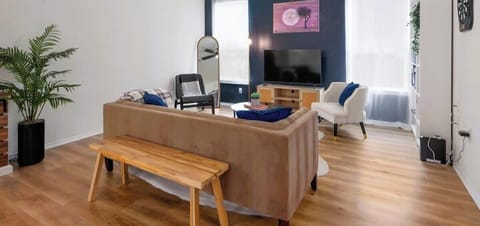 Unwind in this cozy, stylish living area with modern décor—perfect for relaxing after a day of exploring. Watch a movie on the flat-screen TV or enjoy conversation with friends on the comfortable sofa.