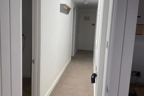 Bright central hallway connecting all rooms — a warm welcome as you step into your holiday home.