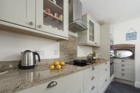 microwave, toaster, kettle, and Nespresso pod coffee machine - Trevethen Cottage