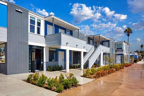 Arrive to crisp coastal architecture steps from the boardwalk.