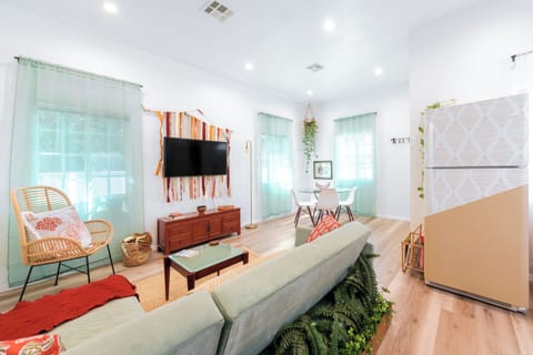 Relax in this unique, cozy open plan living room, dining area and kitchen.