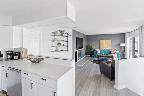 Fully stocked kitchen with rich wood cabinetry, modern appliances, and plenty of counter space