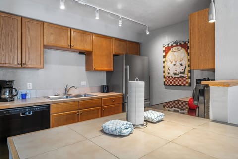 Full kitchen with stainless steel appliances.