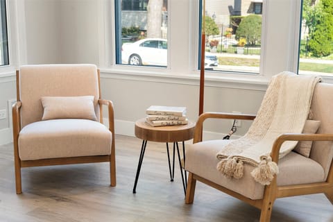 a chic arm chair and a sleek coffee table for relaxing with family or friends.
