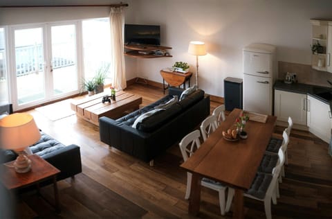 View from the stairs towards the living and kitchen area
