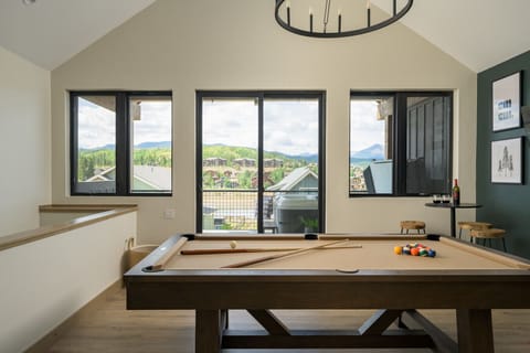 Game loft with pool table, mini bar, smart TV and a walkout patio