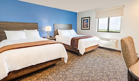 Unwind in a bright double-queen room with open views.