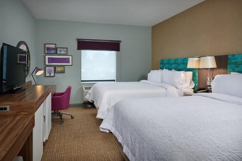 Relax in the airy double-queen room with modern comforts.