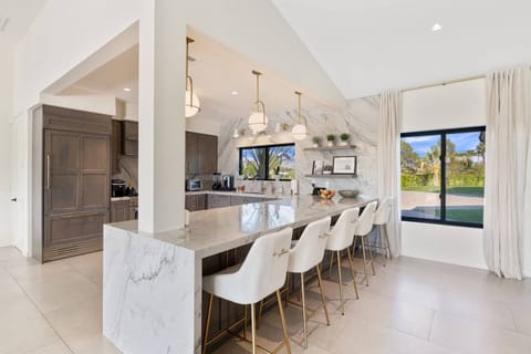 Kitchen with ample seating and outdoor views