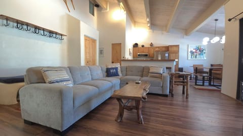 Connected Kitchen, dining, gear removal seating and big screen TV.