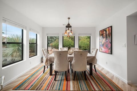 Expansive natural light creates a warm dining space