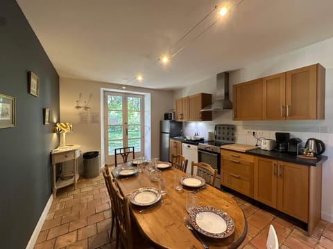 kitchen, micro wave, fridge, dining table, dishwasher, oven, toaster, coffee machine, kettle