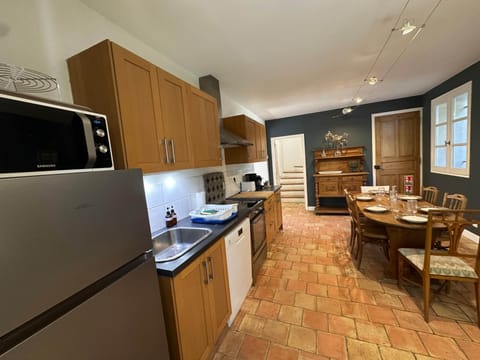 kitchen, micro wave, fridge, dining table, dishwasher, oven, toaster, coffee machine, kettle