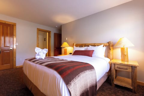 Unwind into crisp linens and rustic lamps after adventure.