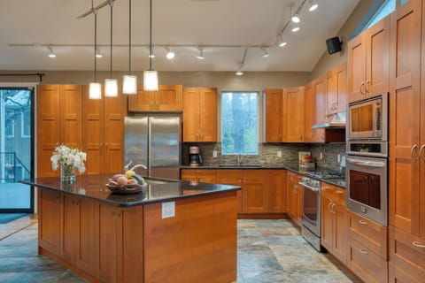 Spacious kitchen with pendant lights.