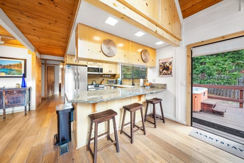 Gourmet kitchen with a center island and bar seating.