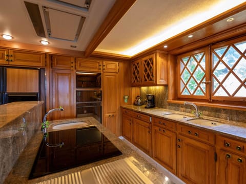 Kitchen, Countertop, Wood, Interior Design, Flooring, Ceiling, Cabinetry, Lighting, Light Fixture, Floor