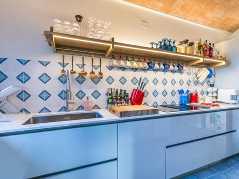 Kitchen, Interior Design, Countertop, Flooring, Kitchen Stove, Kitchen Appliance, Major Appliance, Floor, Room, Gas Stove