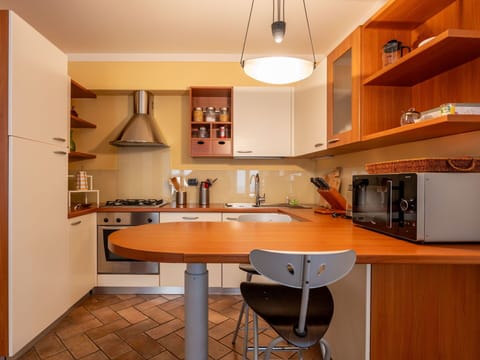 Furniture, Kitchen, Countertop, Kitchen Appliance, Interior Design, Cabinetry, Major Appliance, Wood, Flooring, Light Fixture