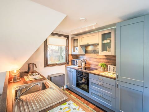 Kitchen, Wood, Interior Design, Flooring, Furniture, Cabinetry, Countertop, Major Appliance, Kitchen Appliance, Floor