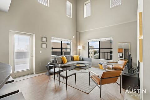 Living room with plenty of seating and high ceilings