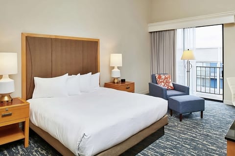Wake up to soft daylight near your private balcony doors.