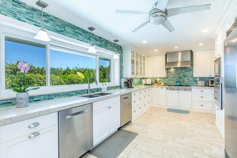 Big enough for the whole family to cook, snack, and hang out—this beachy kitchen brings the colors of the sea inside