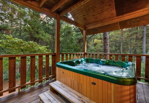 Another private hot tub retreat on the deck—perfect for soaking away stress while watching the forest sway around you.