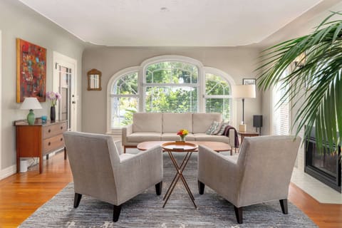 Stepping inside this classic Palo Alto home, you'll immediately feel warm and welcome, thanks to a tasteful vibe and furniture, plus windows overlooking the front lawn.