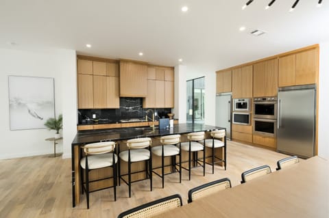 Gourmet Kitchen: Sleek design meets luxury appliances for culinary adventures!