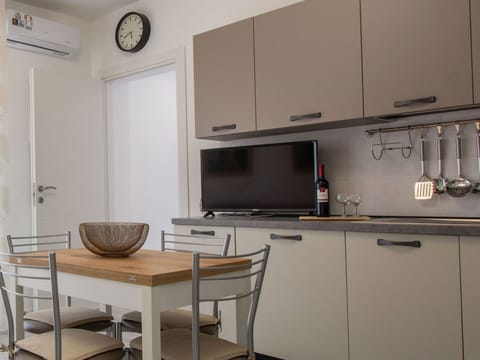 Furniture, Kitchen, Countertop, Interior Design, Cabinetry, Kitchen Appliance, Wood, Major Appliance, Flooring, Room