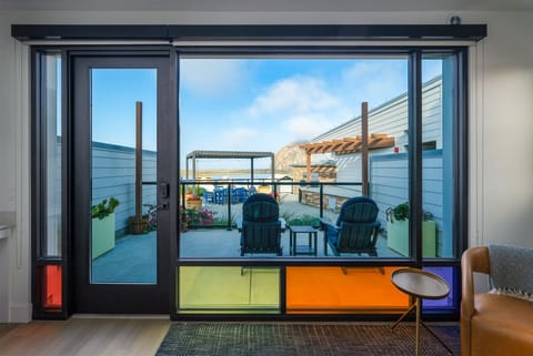 Step outside onto your patio overlooking the shared community BBQ area to enjoy views of the rock and harbor beyond