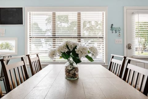 Open living and dining area filled with natural light—perfect for gatherings.
