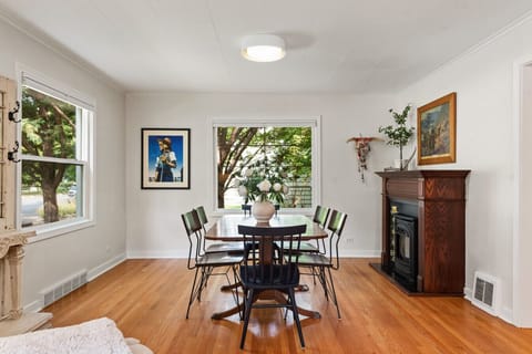 Dining room with gorgeous antique decorative fireplace/mantle.