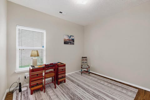 Private, quiet workspace with desk and chair, ideal for remote work or emails.