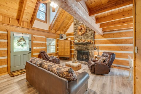 Living room with stone gas fireplace.