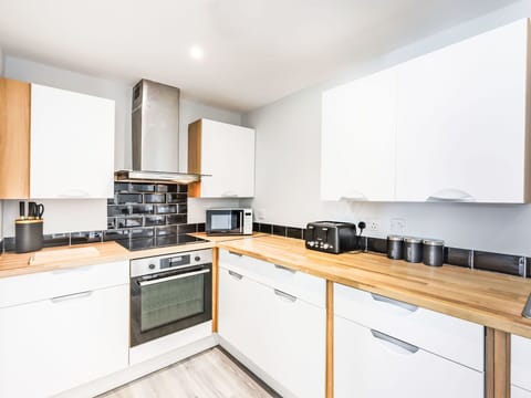 Kitchen, Countertop, Interior Design, Flooring, Wood, Cabinetry, Major Appliance, Kitchen Appliance, Floor, Furniture