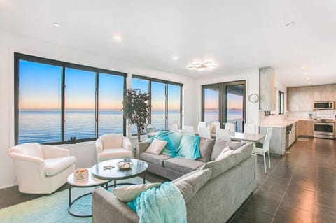 Relax in the living area where every glance meets the shimmering waters—your front-row seat to Bainbridge’s natural beauty.