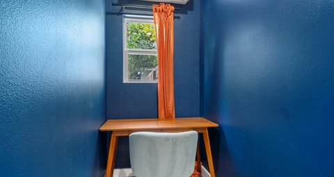 Productivity desk area in twin double bedroom