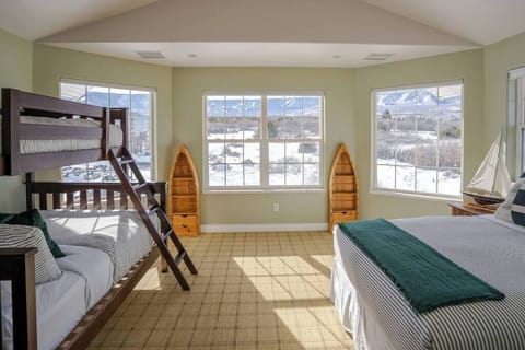 Second bedroom upstairs with comfy queen bed and twin over full bunkbed