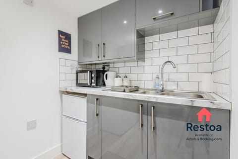 Kitchenette with all essentials including toaster and microwave