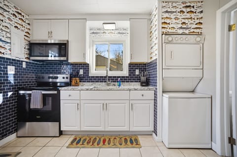 In-kitchen stackable washer and dryer for those longer stays.