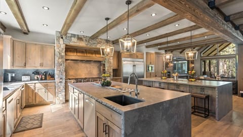 Kitchen: Main floor, dual islands, stainless steel appliances, drip coffee maker, Keurig, toaster, cooking utensils, tableware