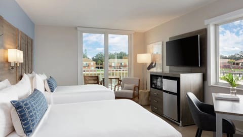 Unwind in a bright room with balcony breezes and seating.