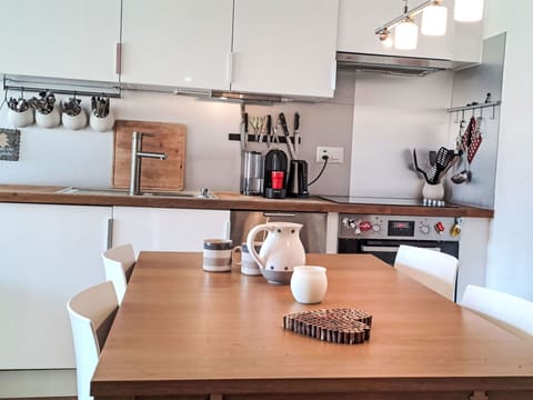 Furniture, Kitchen Appliance, Kitchen, Countertop, Interior Design, Cabinetry, Major Appliance, Wood, Flooring, Home Appliance